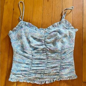 Aster floral chiffon tank with adjustable straps, smocked back, and zipper.